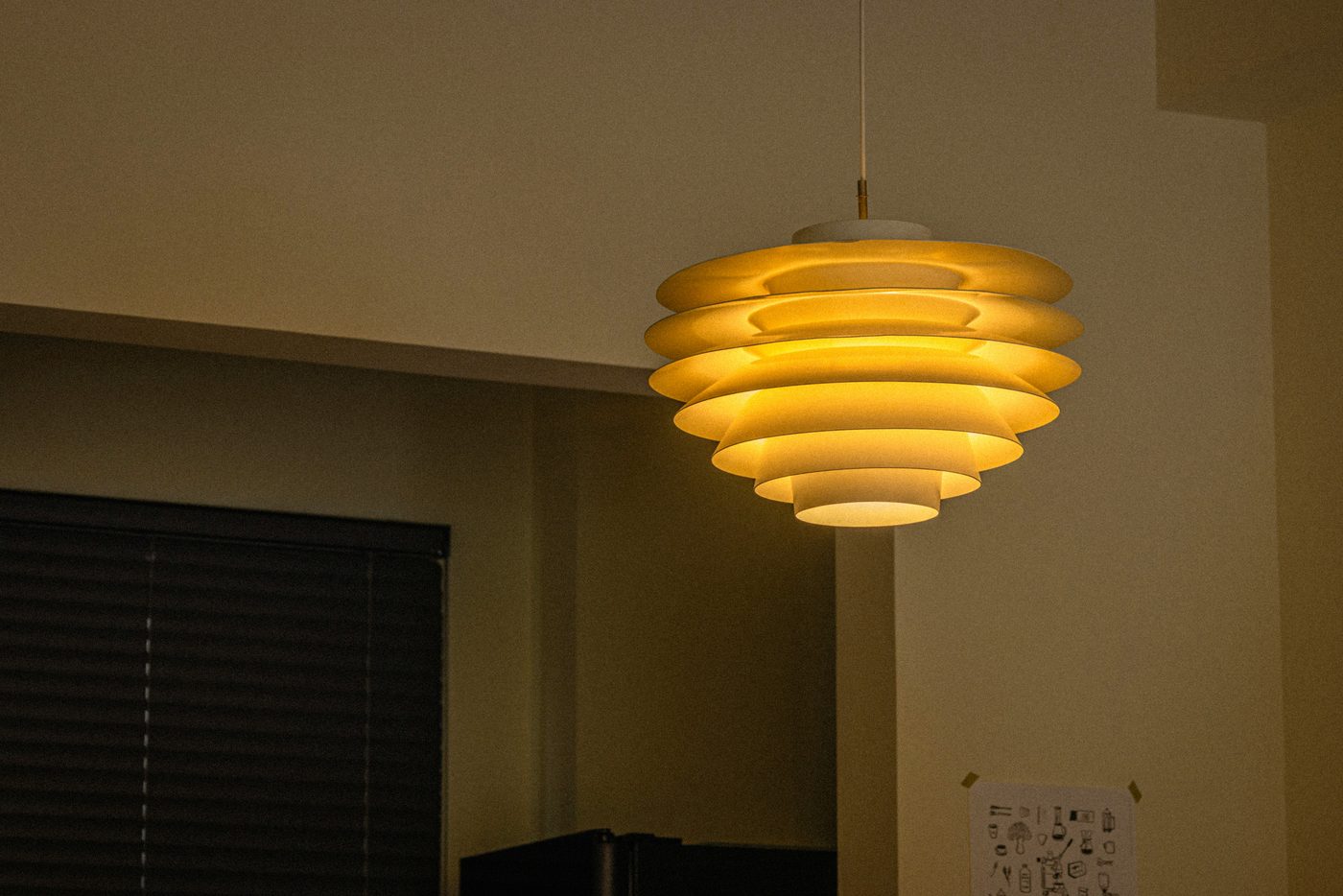 Five pools of warm light in a living room