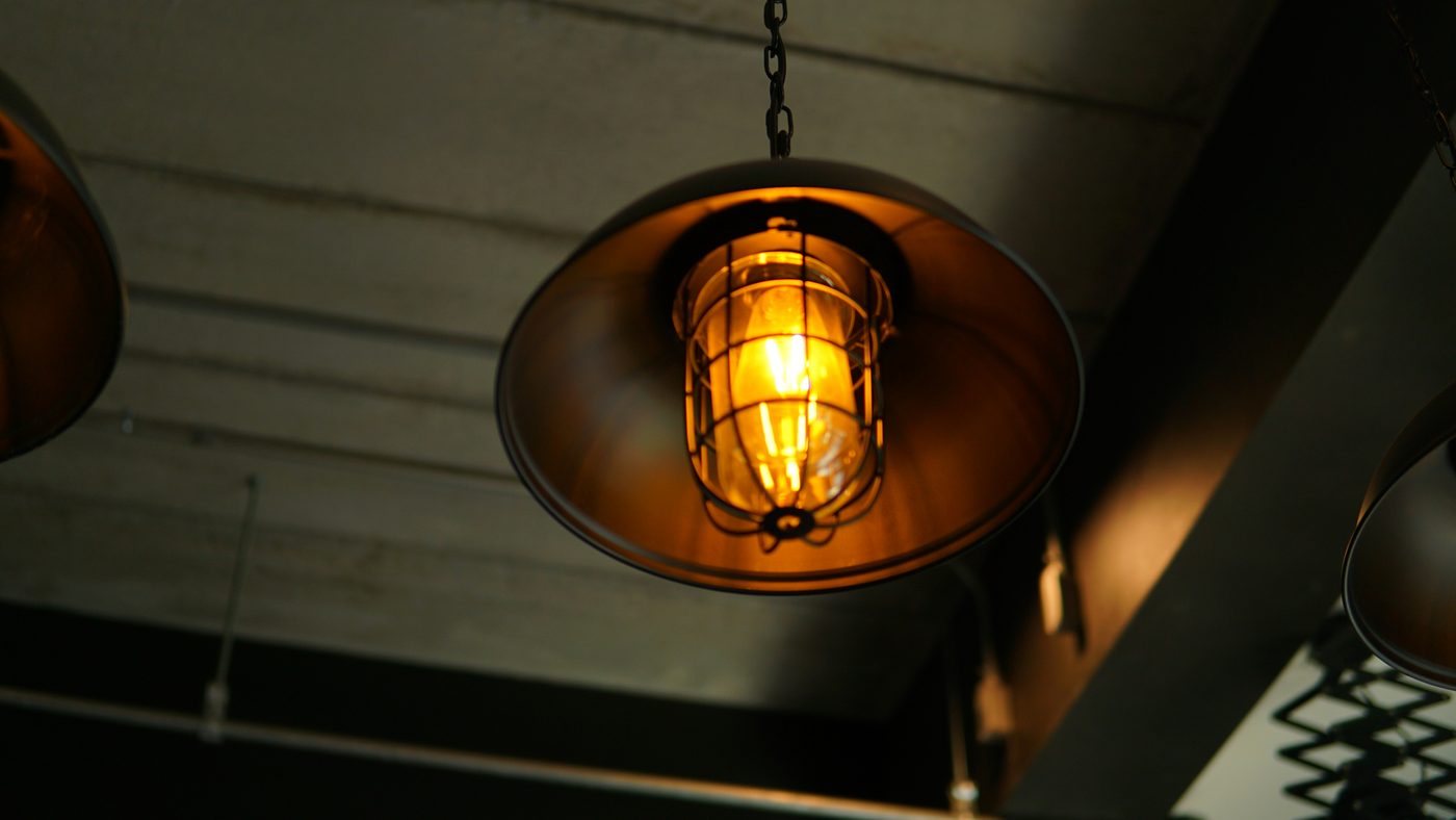 A warm pendant softly lighting a period room